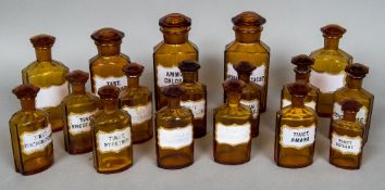 A quantity of Victorian amber glass apothecary bottles Each with a facet cut stopper and each with