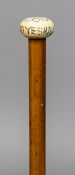 An ivory handled malacca walking stick The top with pique inlays inscribed Seek and Ye Shall Find.