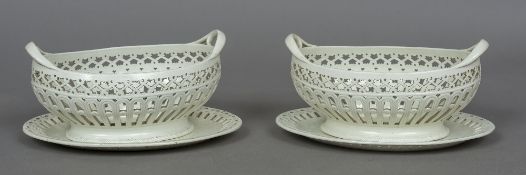 A pair of late 18th/early 19th century Staffordshire creamware twin handled baskets and stands,