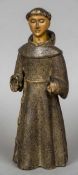 A 19th century carved wood and gesso polychrome figure of a monk 34.5 cm high.