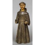 A 19th century carved wood and gesso polychrome figure of a monk 34.5 cm high.