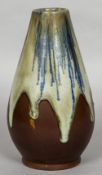 An Art pottery vase With drip glazed decoration, the underside indistinctly signed. 21 cm high.