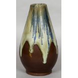 An Art pottery vase With drip glazed decoration, the underside indistinctly signed. 21 cm high.