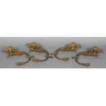 A set of four Victorian gilt bronze wall sconces Each with a single scrolling branch surmounted