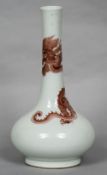 A Chinese porcelain bottle vase Iron red decorated with a dragon,