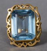 A blue stone, possibly aquamarine,