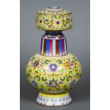 A fine Imperial Chinese famille rose porcelain Tibetan style altar vase or benbaping The body
