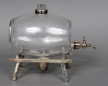An early 20th century silver plate mounted clear glass spirit barrel Of typical form,