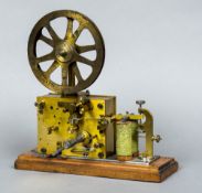 A 19th century twin coil electric and clockwork ticker tape machine,