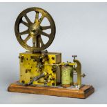 A 19th century twin coil electric and clockwork ticker tape machine,