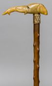 A Victorian horn handle, possibly rhino horn, walking cane The handle carved as an elephant.