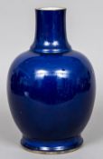 A Chinese porcelain vase With allover blue glaze, drilled for electricity and ground down. 30.