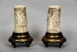 A pair of 19th century Japanese carved ivory vases Each intricately worked in the round with