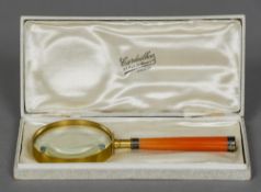 An early 20th century French unmarked white metal mounted magnifying glass Housed in original plush