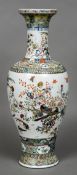 A Chinese porcelain vase Of baluster form, decorated in the round with birds amongst floral sprays.