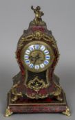 A 19th century boulle mantel clock The top surmounted with a gilt metal putto,