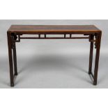 A 19th century Chinese hardwood altar table The cleated rectangular top above the carved pierced