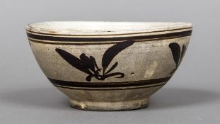 A Chinese Cizhou stoneware bowl Typically decorated. 15 cm diameter.