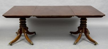 A 19th century and later mahogany twin pillar dining table The rounded rectangular top enclosing a