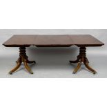 A 19th century and later mahogany twin pillar dining table The rounded rectangular top enclosing a