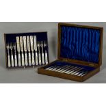 A set of Victorian and later silver fruit knives and forks, hallmarked Sheffield 1899, 1900, 1907,