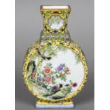 A Chinese porcelain moon flask Decorated with bird vignettes within lotus strapwork on a yellow