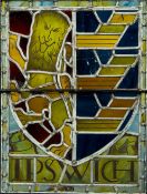 A stained glass panel Worked with the Ipswich Town coat-of-arms and inscribed Ipswich, framed.