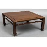 A late 19th/early 20th century Chinese low table Of panelled square form,