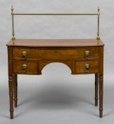 A small 19th century mahogany sideboard The tubular brass back rail above the moulded bow front top