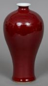 A Chinese ox blood red vase Of tapering bulbous form,