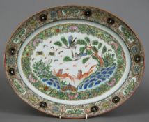 A large 19th century Cantonese famille rose platter Of dished oval form,