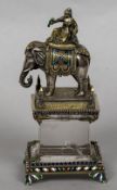 An unmarked white and gilt metal enamelled desk piece,