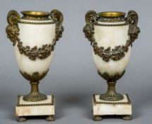 A pair of 19th century gilt metal mounted alabaster urns The handles worked as horned pan masks