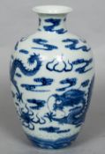 A Chinese blue and white porcelain dragon vase Decorated with five-clawed dragons chasing a flaming
