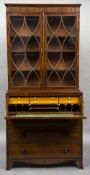 An early 19th century mahogany secretaire bookcase The upper section with twin astragal glazed
