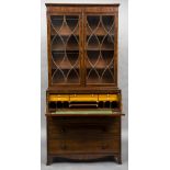 An early 19th century mahogany secretaire bookcase The upper section with twin astragal glazed