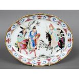 A Chinese porcelain dish Decorated with horsemen and attendants within a wavy gilt rim. 27 cm wide.