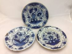 Three antique blue and white Delft plates Each decorated with floral sprays,