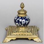 A Victorian brass mounted pottery inkwell The spherical body worked with prunus blossom. 13.