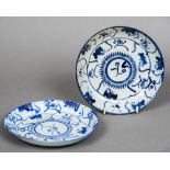 A pair of Oriental blue and white dishes Each approximately 17 cm diameter.