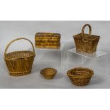 A miniature wicker picnic basket Together with another lidded basket,