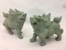 A pair of Chinese carved green stone temple lions 12.5 cm high.