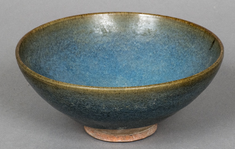 An antique Chinese pottery footed dish With a blue/turquoise glaze,