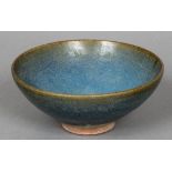 An antique Chinese pottery footed dish With a blue/turquoise glaze,