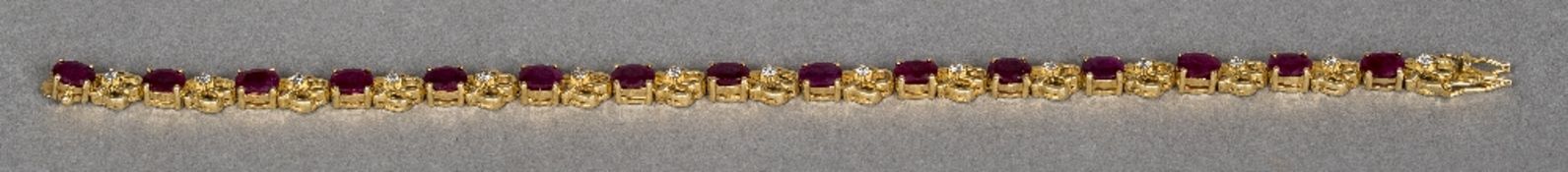 A 14 ct gold ruby and diamond set fancy link bracelet 20 cm long.