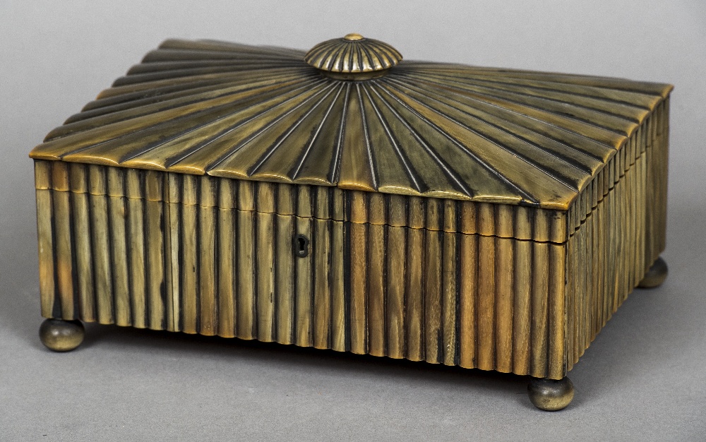 A 19th century Anglo-Indian horn veneered needlework box The hinged domed lid with a squat knop