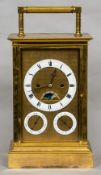 A large brass cased moonphase calendar four glass carriage clock The tooled dial plate with white