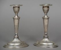 A pair of Victorian silver candlesticks, hallmarked London 1884,