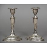 A pair of Victorian silver candlesticks, hallmarked London 1884,