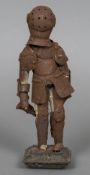 A small articulated model of a suit of armour,